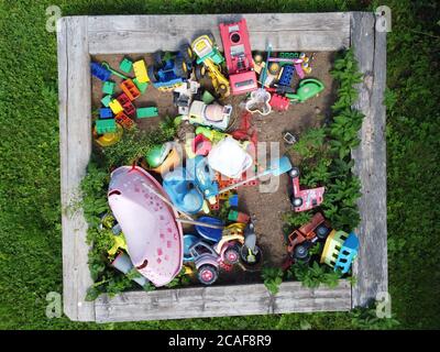 children's toys in the sandbox. Top view Stock Photo