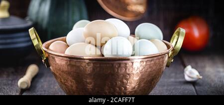 Brazilian free-range eggs, natural free-range eggs from Minas Gerais, in copper pots. Typical Brazilian cuisine. Stock Photo