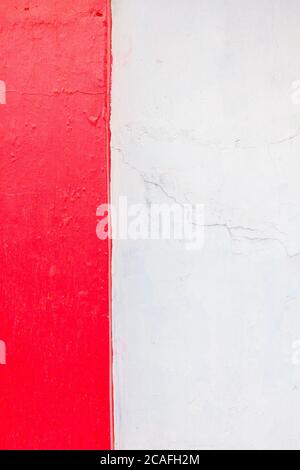 Old texture turquoise red and white cracked wall, the old paint texture is chipping and cracked fall destruction. Vertical format Stock Photo