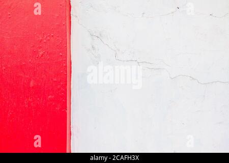 Old texture turquoise red and white cracked wall, the old paint texture is chipping and cracked fall destruction Stock Photo