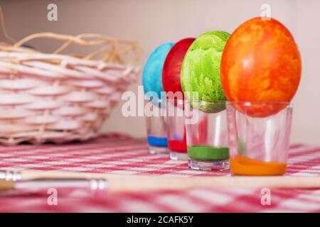Easter eggs painted in various colours on the glasses Stock Photo