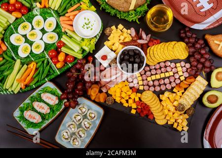 Beverage and snacks for superball american football game fans. Stock Photo