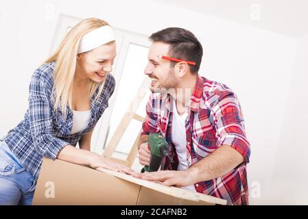 Young happy couple repairing and renovating their new house Stock Photo