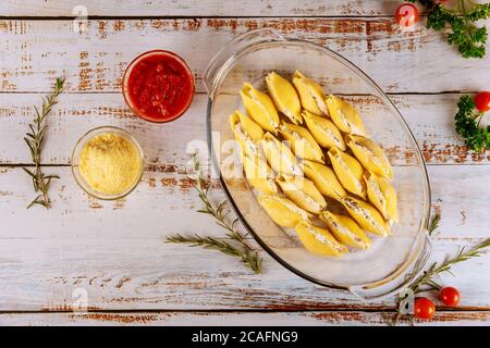 Stuffed pasta jumbo shells with ricotta, parmesan cheese and sauce. Stock Photo