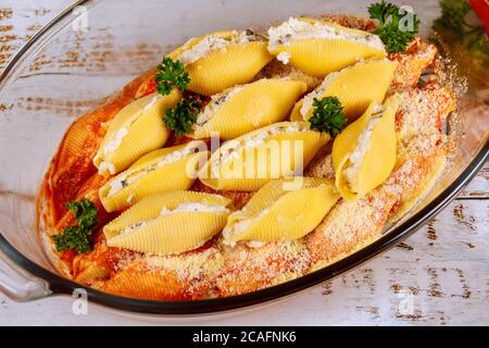 Stuffed jumbo pasta shells with mushroom and ricotta cheese. Stock Photo