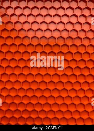 texture made of orange plastic in the form of honeycombs close-up, abstract background Stock Photo