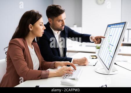 Convertible Laptop With Gantt Software Chart And Agenda Stock Photo