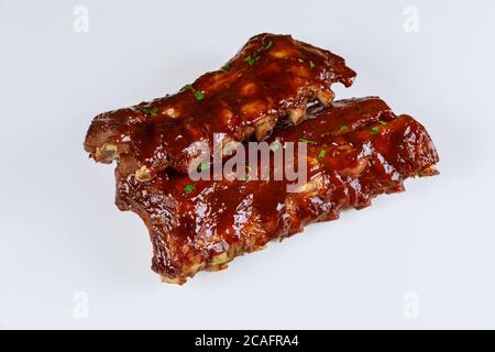 Hickory smoked barbecue beef ribs on isolated white background. Stock Photo