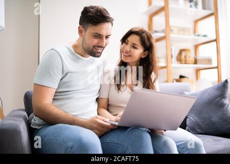 Couple Shopping Online. Woman Buying In Internet Retail Store Stock Photo