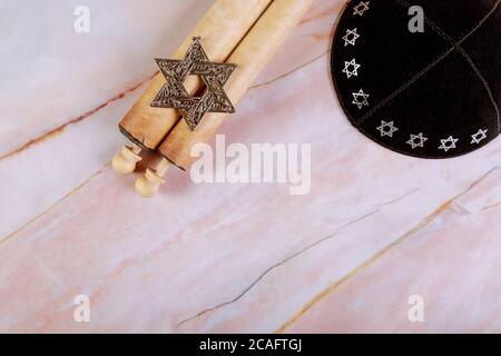 Jewish background with kippa and papyrus roll with star of David.. Stock Photo