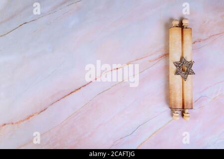 Jewish manuscript, old papyrus roll on abstract background. Stock Photo