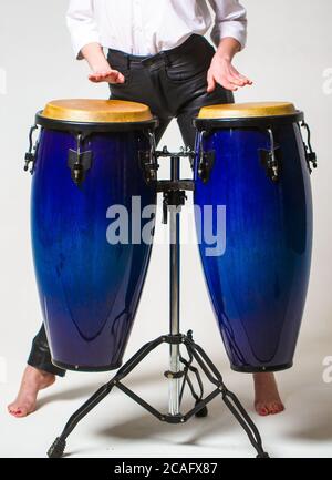 Close up of musician hand playing bongos drums. Drum. Hands of a musician playing on bongs. Performers playing bongo drums Stock Photo