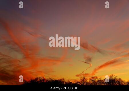 Colorful biautiful sunset sky with few clouds for wallpaper. Stock Photo
