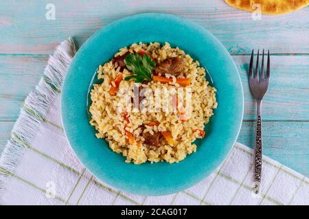 Delicious lunch with stewed rice ,meat and carrot. Eastern food. Stock Photo