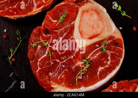 Beef shank bone in with seasonings and herbs. Close up. Stock Photo