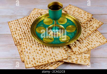 Matzah, kiddush and seder with text in hebrew egg, bone, horseradish ...