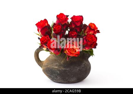 red roses in a vase on white background Stock Photo