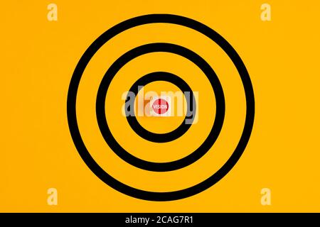 Target with the word vision written on a wooden block as the bulls eye on yellow background. Concept of aiming at the vision or business goals. Stock Photo