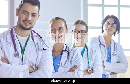 Smiling team of doctors and nurses at hospital Stock Photo