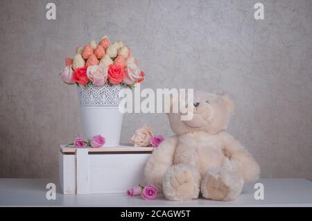 Fruit bouquet decoration with teddy bear toy on the table Stock Photo