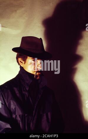 Man posing as a gangster. Stock Photo
