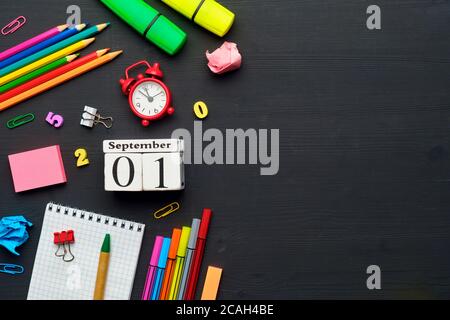Holiday concept back to school with calendar date september on wooden background. Stock Photo