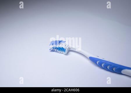 blue toothbrush on a white background. healthy and clean teeth concept, dentistry. High quality photo Stock Photo