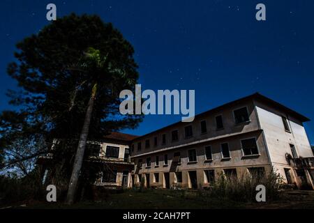 Abandoned Hotel in moonlight at Campos Novos Paulista - Brazil Stock Photo