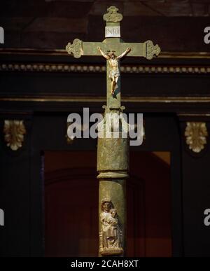 Spain, Catalonia, Tarragona province, Montblanc. The Convent and Sanctuary de la Serra. The Virtues Cross or the Green Cross. It is a 12th century wayside cross. Romanesque style in green jasper, with a small image of the Virgin Mary. Stock Photo