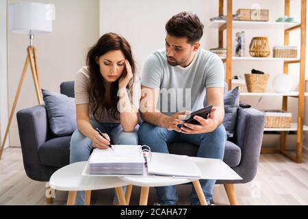 Family In Financial Trouble Having Stress Over Debt And Money Stock Photo