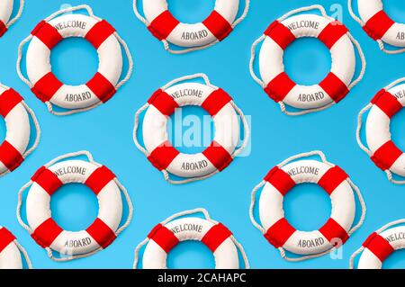 Nautical rescue, lifesaver help and SOS concept with red and white life ring repeating to create a seamless pattern isolated on blue background Stock Photo