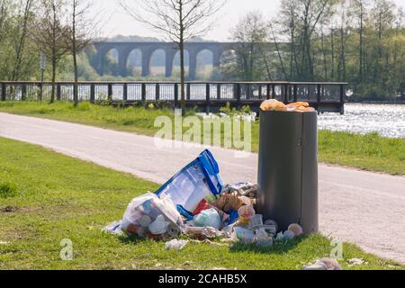 Litter overflowing from bins in Germany Stock Photo