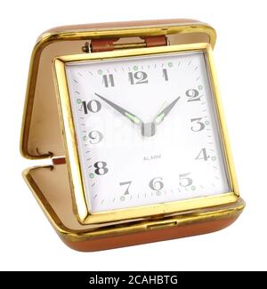Old retro travel alarm clock isolated on a white background Stock Photo