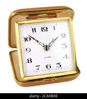 Old retro travel alarm clock isolated on a white background Stock Photo