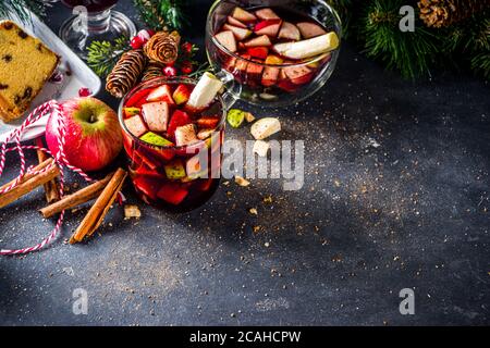 Festive winter fruit punch or sangria drink. Christmas mulled red wine. Ponche de frutas Navideño cocktail, Mexian Christmas hot  beverage with sugar Stock Photo