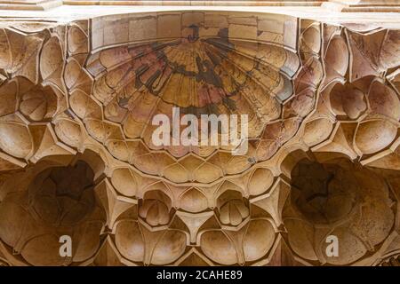 Damascus, Syria 03/28/2010: Bug eye view of  clusters of concave dome or half dome shaped stone carvings decorating  ceiling of a gateway in a histori Stock Photo
