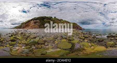 360 degree panoramic view of Fisherman casting hand line while another man having cup of tea at Scenic North beach off Greystones, Irish Sea, co. Wicklow. 360 panorama.