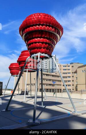 'Dortmunder Rosen' vibrant red public art installation made from recycled car lights by Winter / Hoerbelt, outside Dortmunder U museum, Germany Stock Photo