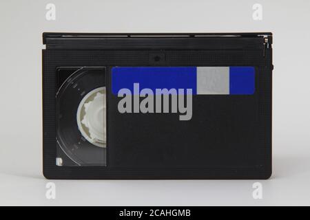 MiniDV and VHS video tape isolated on white. SD and MicroSD cards.  Cassettes. USB 3.0 pendrive. Stock Photo