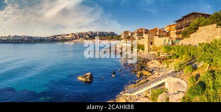 Coastal landscape banner, panorama - embankment with fortress wall in the city of Sozopol on the Black Sea coast in Bulgaria Stock Photo