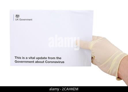 Letter envelope from United Kingdom Government to every household in UK with vital updates about Coronavirus and lock down rules, isolated on white