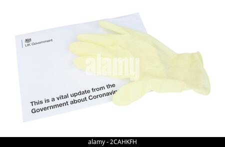 Letter envelope from United Kingdom Government to every household in UK with vital updates about Coronavirus and lock down rules, isolated on white Stock Photo