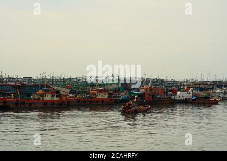 Jakarta, Indonesia - April 21, 2019: Fishing boats anchored at the Muara Angke Port, Penjaringan, North Jakarta.
