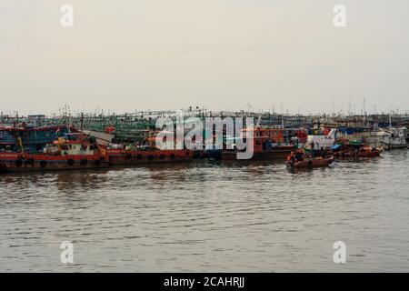 Jakarta, Indonesia - April 21, 2019: Fishing boats anchored at the Muara Angke Port, Penjaringan, North Jakarta.