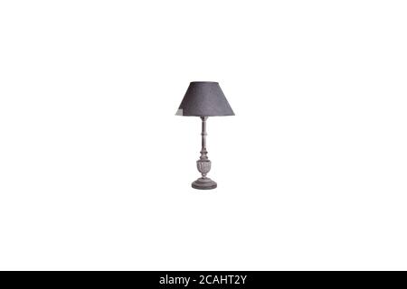 dark wood colored table lamp and shade with stand on white back ground Stock Photo