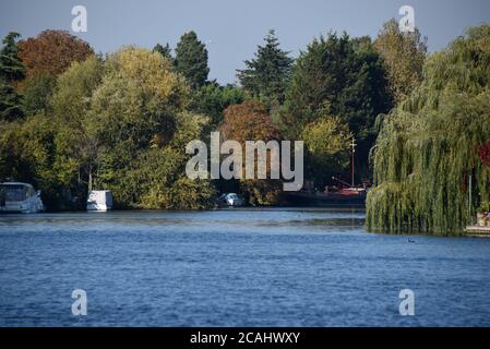 The River Thames is a perfect shade of blue in this photo taken on a glorious autumn day Stock Photo