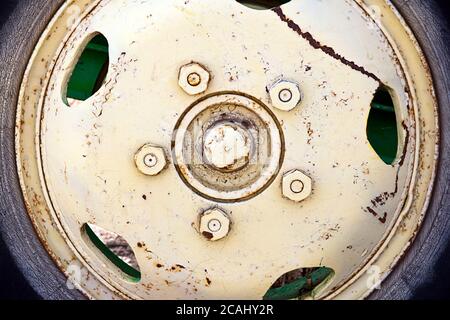 Closeup shot of old cracked rusty wheel metal Stock Photo