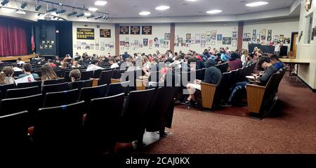 Canton, GA, USA. 7th Aug, 2020. Students at Sequoyah High School gather in auditorium on 4th day of first week of face-to-face school in Cherokee County, Georgia. The school system requires teachers and staff to wear protective masks as a safeguard against transmitting Civic-19 virus, but refused to mandate masks for students. Credit: Robin Rayne/ZUMA Wire/Alamy Live News Stock Photo