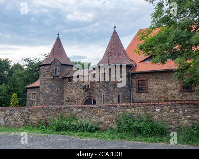 Czocha, Poland-August 25, 2019: Main entrance gate to Czocha Castle and two front bastions. View from outside the castle grounds Stock Photo