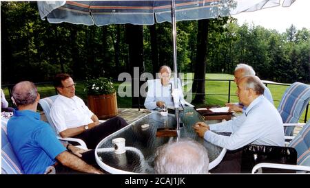 In this file photo, United States President George H.W. Bush meets with Union of Soviet Socialist Republics President Mikhail Gorbachev and thei key foreign policy advisors at Aspen Lodge, Camp David, Maryland on June 2, 1990. From left: United States Secretary of State James A. Baker III, President Bush, United States National Security Advisor Brent Scowcroft, Union of Soviet Socialist Republics Foreign Minister Eduard Shevardnaze, and President Gorbachev. | usage worldwide Stock Photo